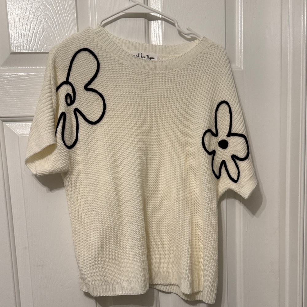 Chic Cream Sweater with Black Floral Accents